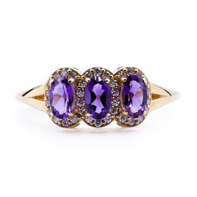 Oval Amethyst Three Stone Ring with Diamond Accented Halo on Split Shank Ring