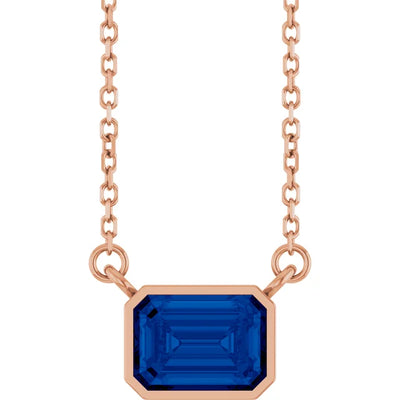 Emerald Center East West Bezel Set Pendant and Necklace