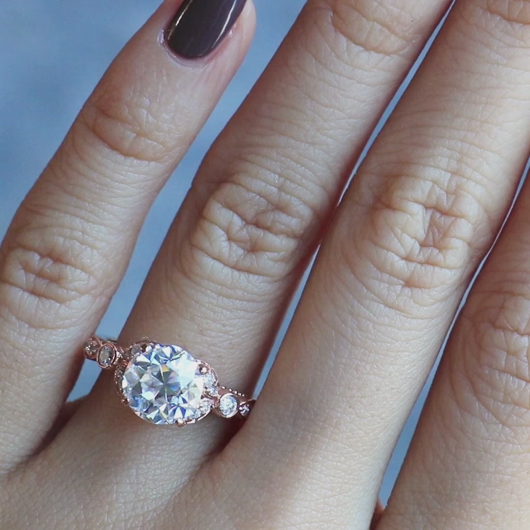 8mm Round OEC Heirloom Moissanite 14K Rose Gold Half Bead Shank and Diamond Bezel Side Ring